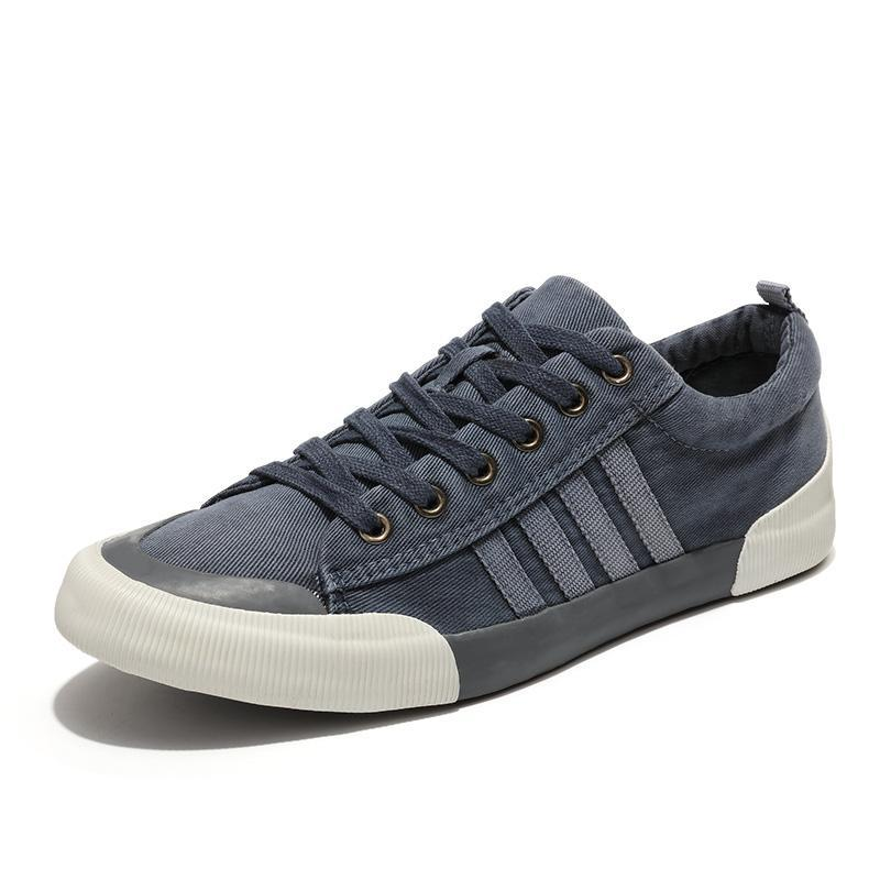 Rock style breathable casual sneakers in navy blue with round toe and lace-up design.