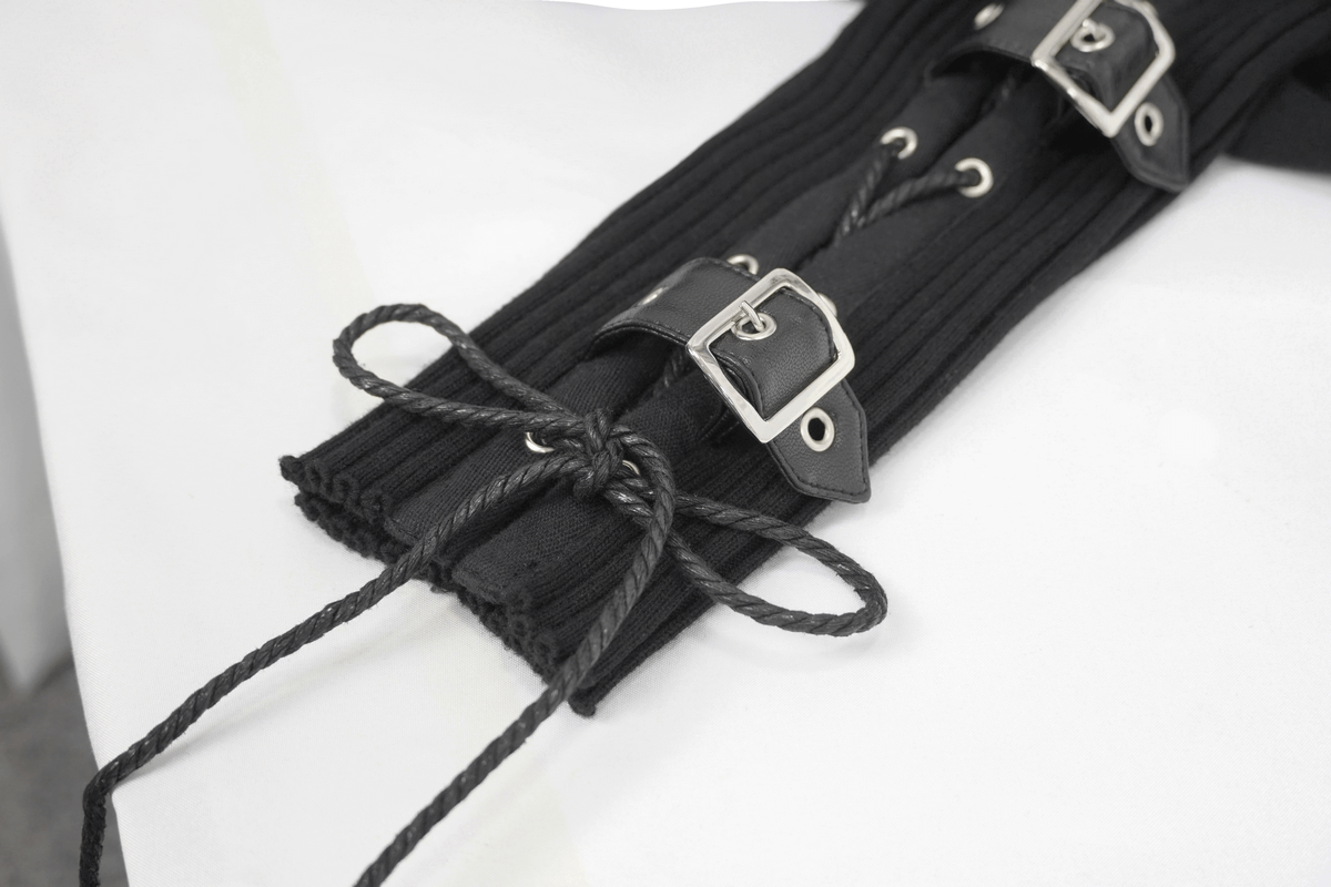 Close-up of lace-up and buckle detailing on a men's punk hoodie sleeve in black fabric.