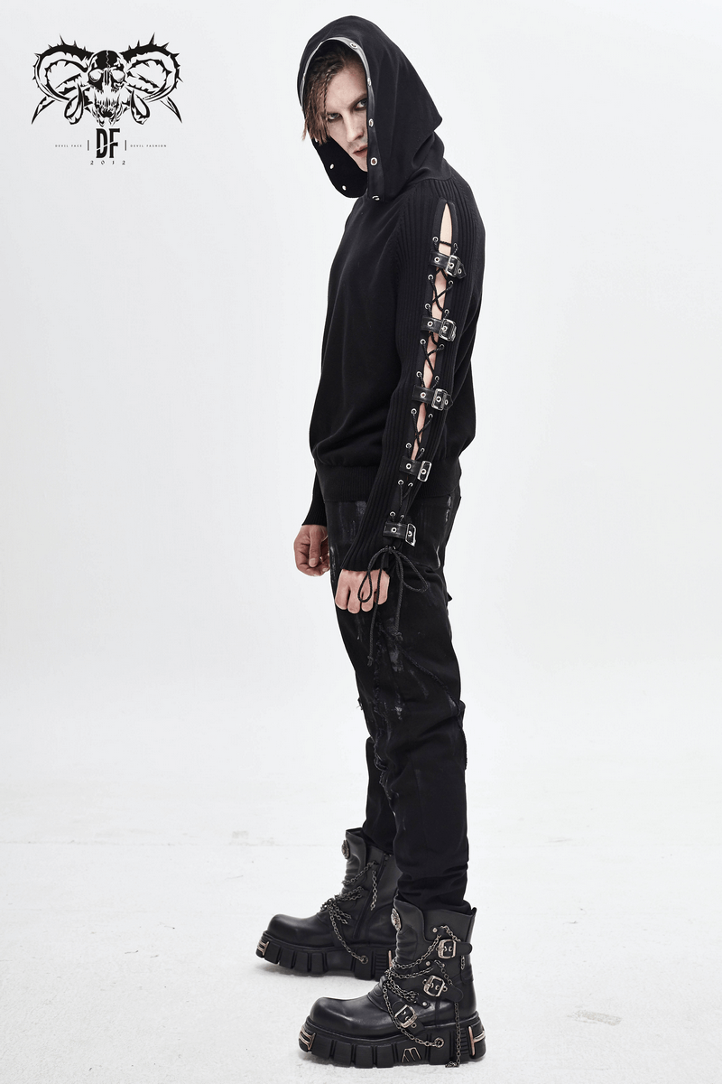 Men's black punk hoodie with lace-up details on sleeves and asymmetrical hood, paired with black pants and chunky boots.