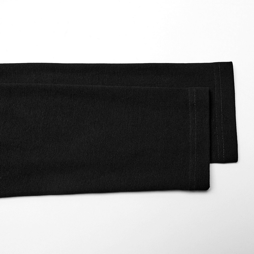 Close-up of black long sleeves highlighting sleek style and stitching details in a fashionable design.