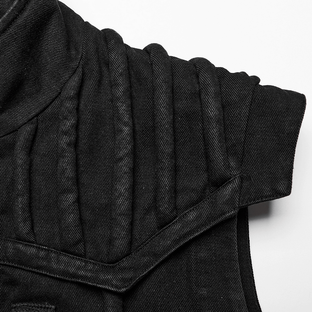 Black distressed denim vest showing shoulder pads and detailed stitching, perfect for a punk-inspired look.