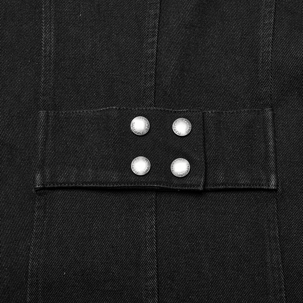 Close-up of buttons on black distressed denim vest, showcasing punk style rivets and edgy design.