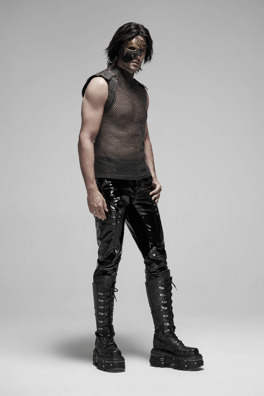Men's punk mesh top with zipper shoulders, styled with glossy trousers and bold boots for an edgy look.