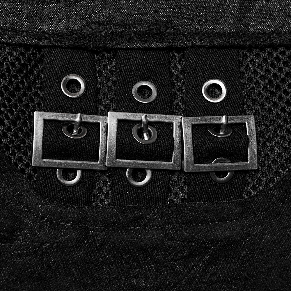 Close-up of black punk-style pants featuring eyelet details and buckle loops for a stylish edge.