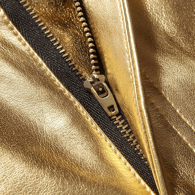 Close-up of a stylish gold zipper on shiny fabric, showcasing a fashionable rock style finish.