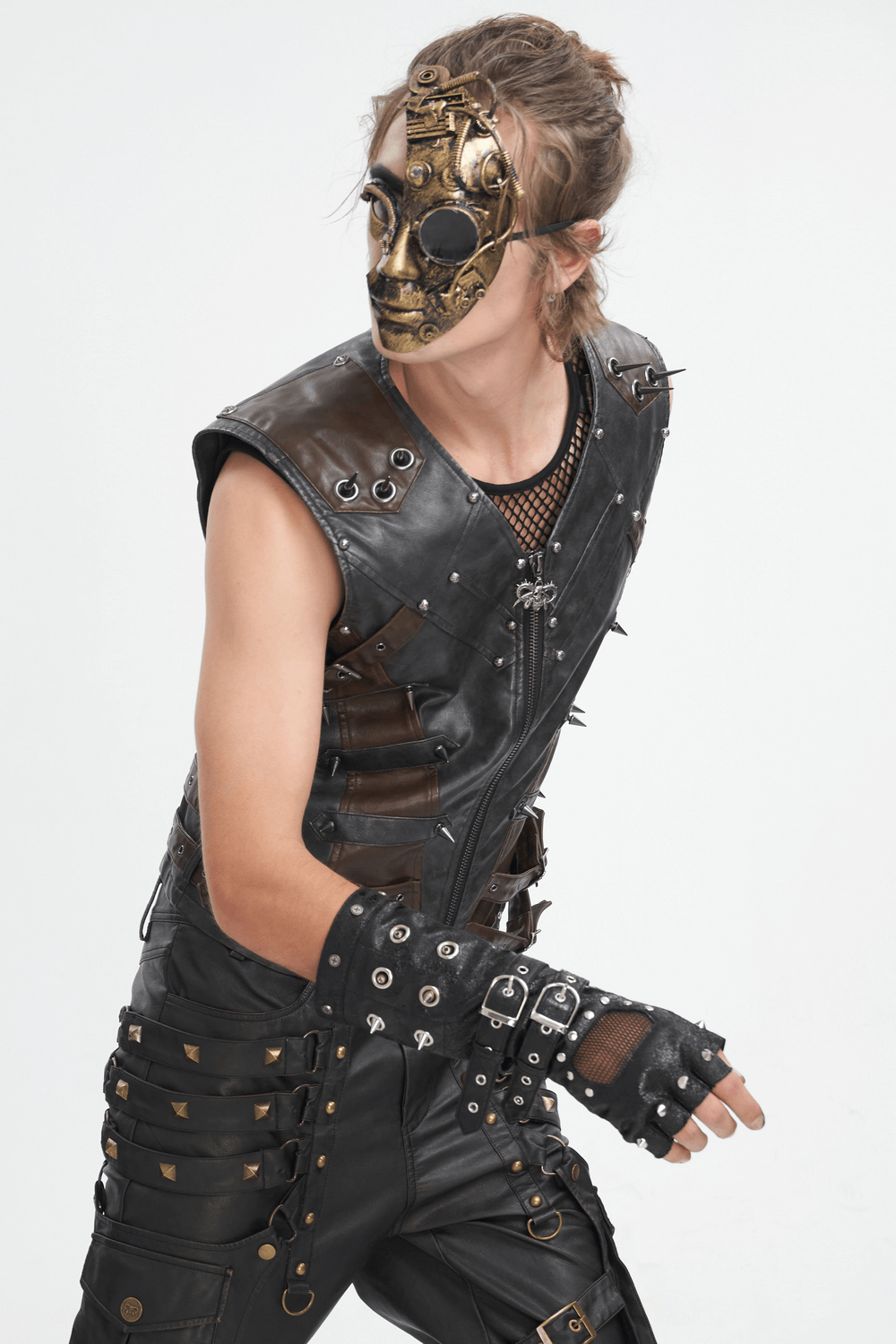 Model wearing steampunk-inspired outfit with a skull mask and studded leather gloves.