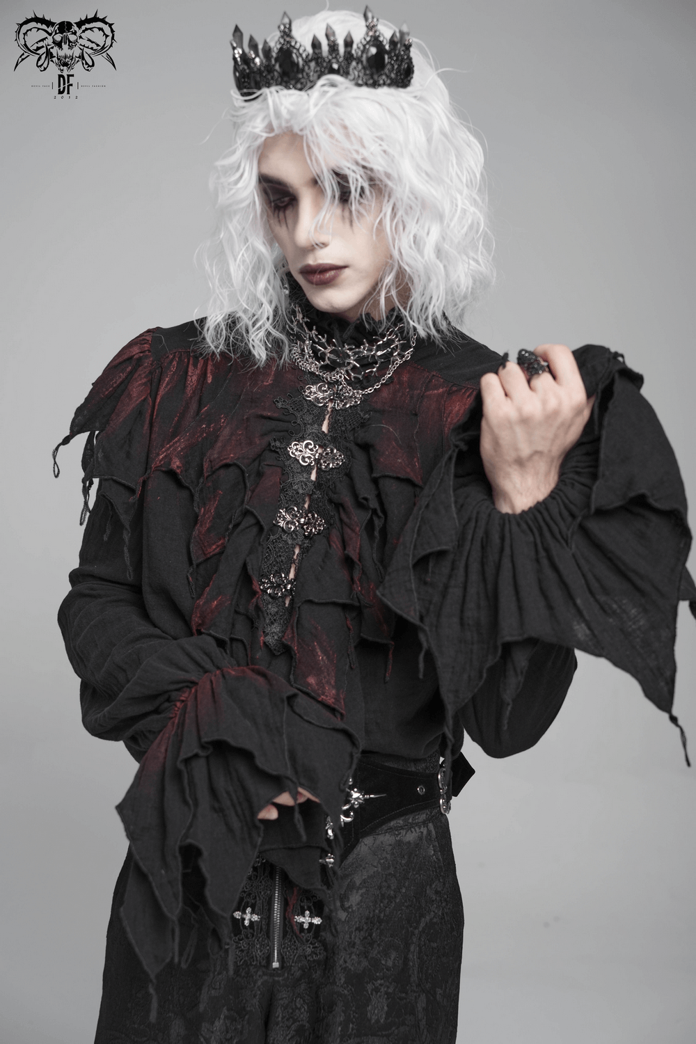 Men's Ruffled Shirt with Silver Clasps and Tattered Sleeves worn by model showcasing a gothic vampire aesthetic.
