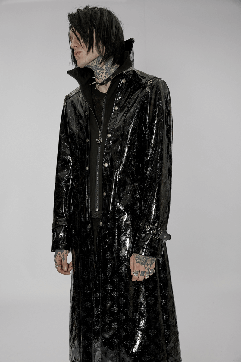 Men's shiny patent leather gothic trench coat with cross detail, showcasing a stylish streetwear look.