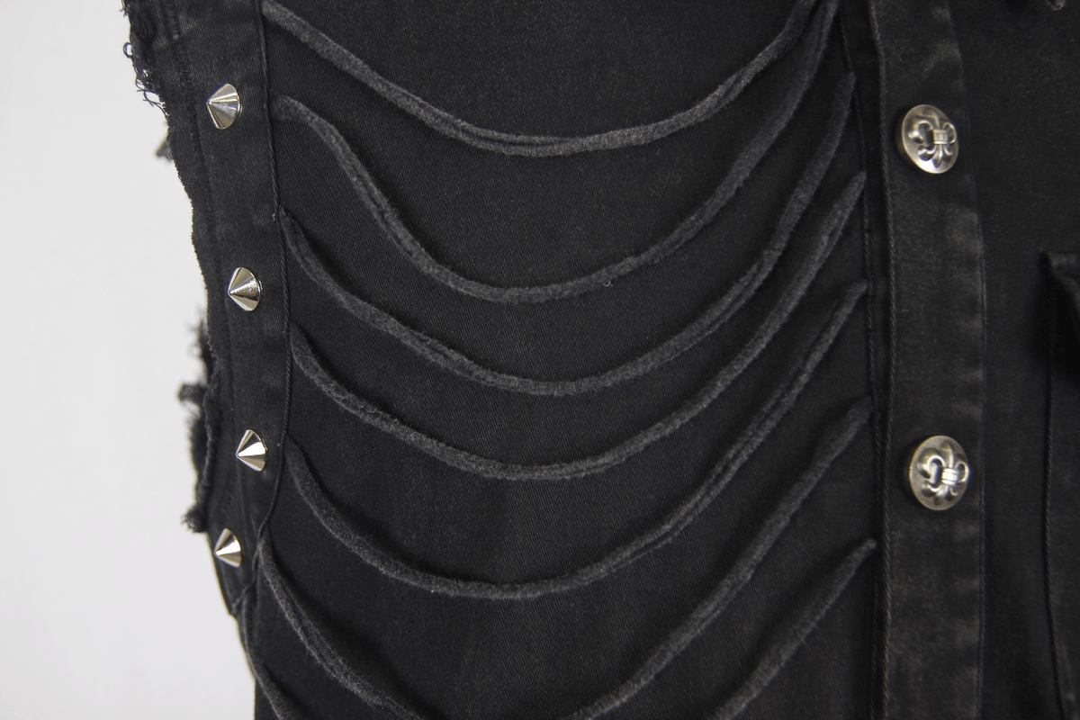 Close-up of men's slim sleeveless black shirt featuring gothic rivets and decorative buttons.