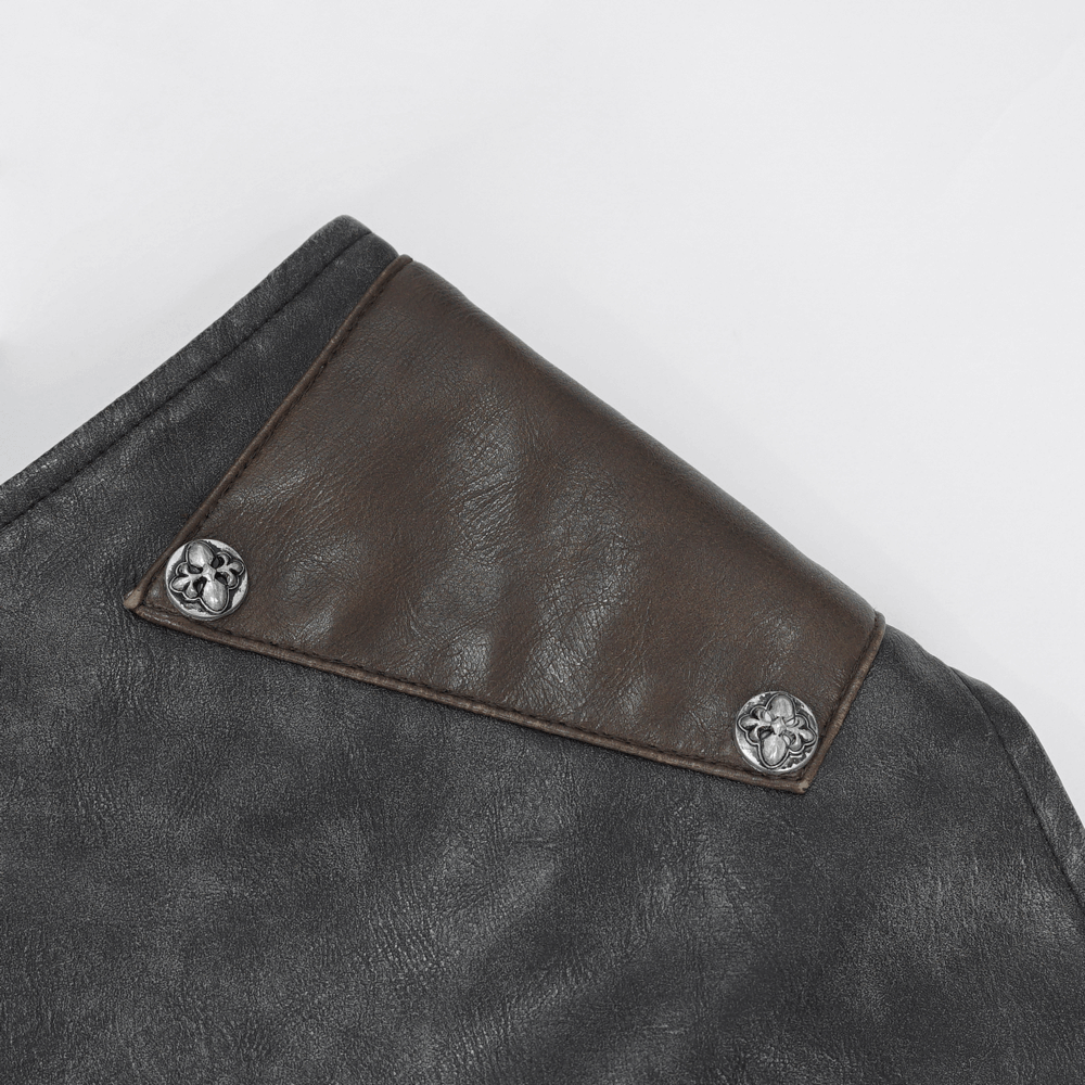 Close-up of leather biker vest collar with decorative studs and stylish flap detail.