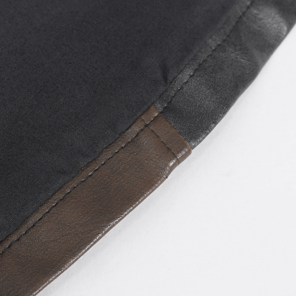 Close-up of the sleek edge of a men's spiked leather biker vest, showcasing the durable leather and stylish stitching.