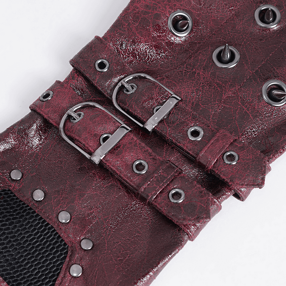 Close-up of maroon steampunk gloves featuring metal buckles and studs, perfect for adding an edge to your outfit.