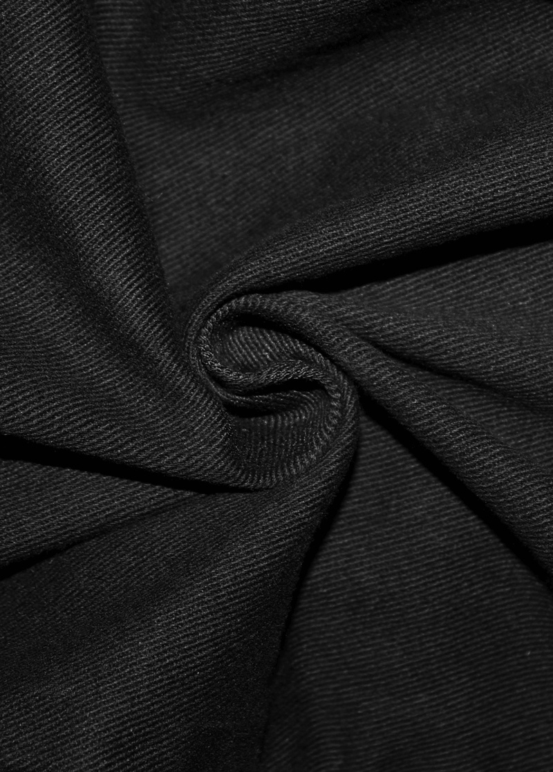 Close-up of black fabric showcasing a soft, textured surface, perfect for stylish men's tight pants.