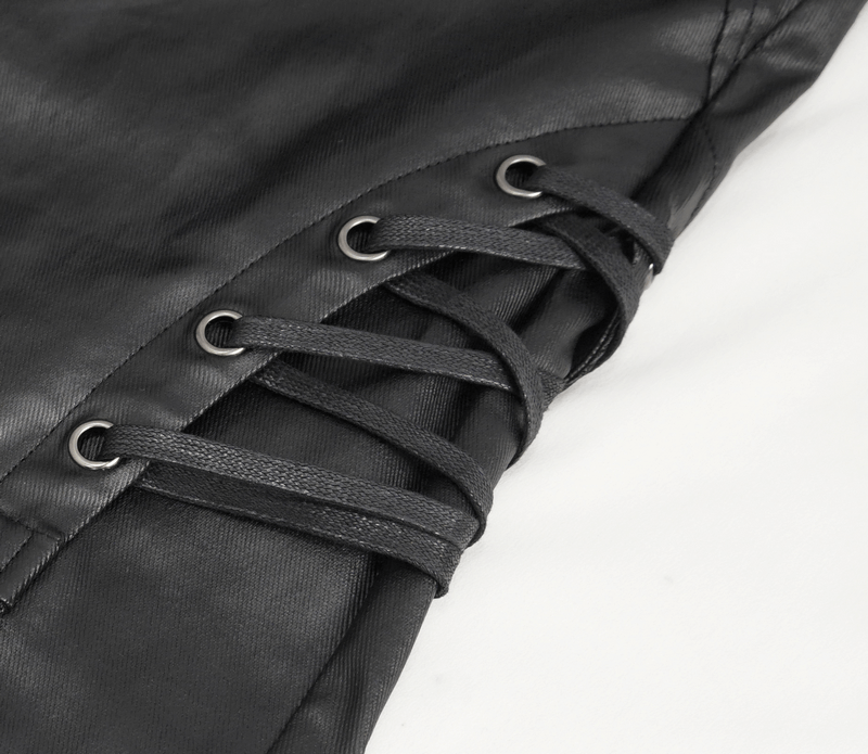 Close-up of stylish black leather biker pants detailing with metal accents and lace-up design.