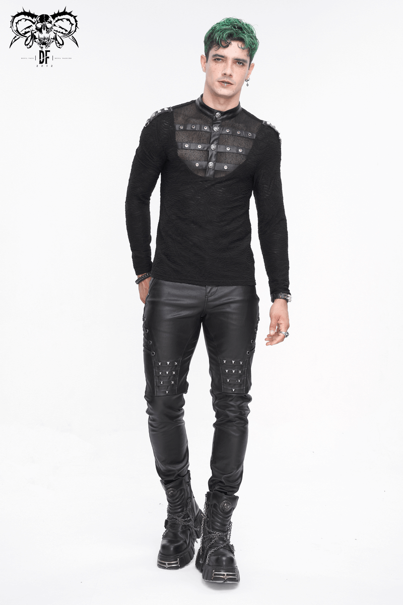 Stylish model in black leather biker pants and edgy black shirt with metal accents, showcasing bold fashion.
