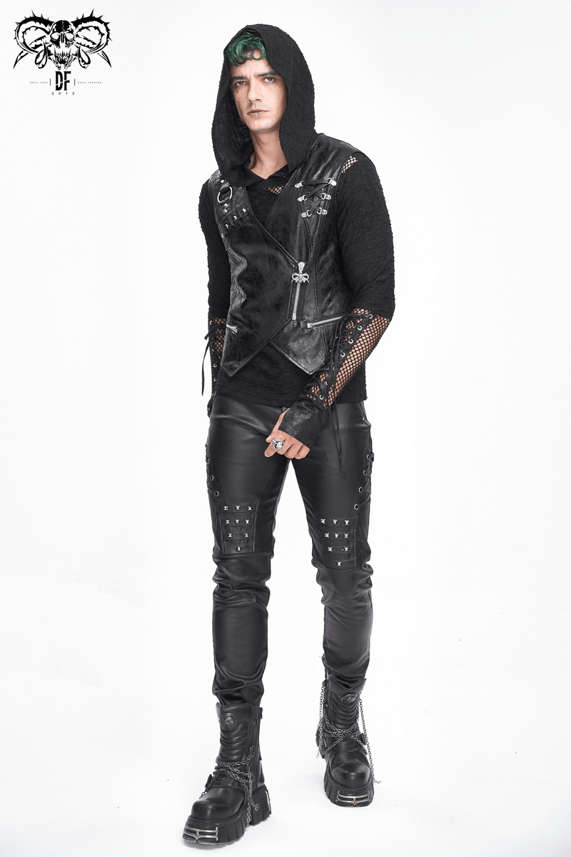 Trendy man in stylish black leather biker pants with metal accents and a hooded vest, showcasing edgy fashion.