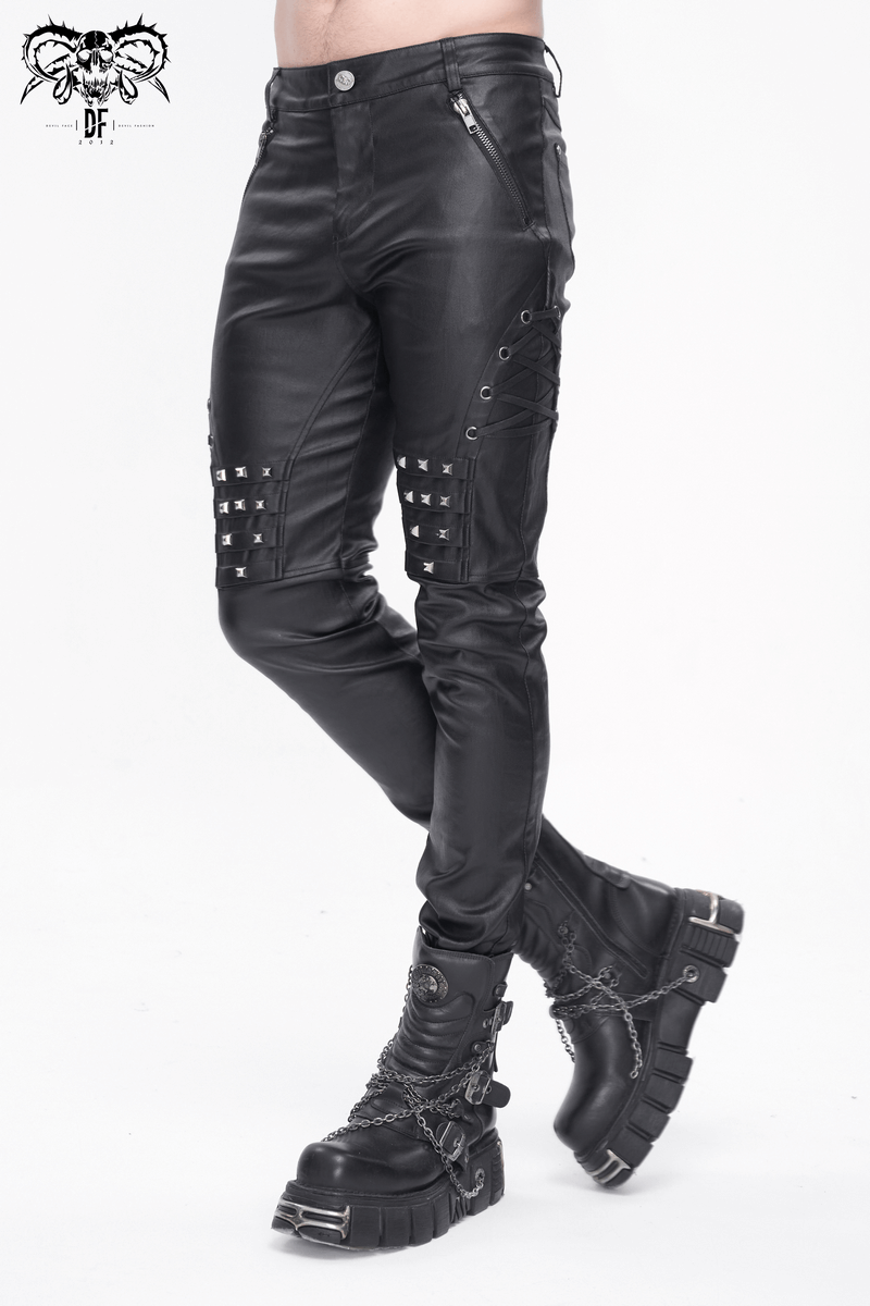 Men's black leather biker pants with metal accents paired with edgy black boots, showcasing a bold fashion statement.