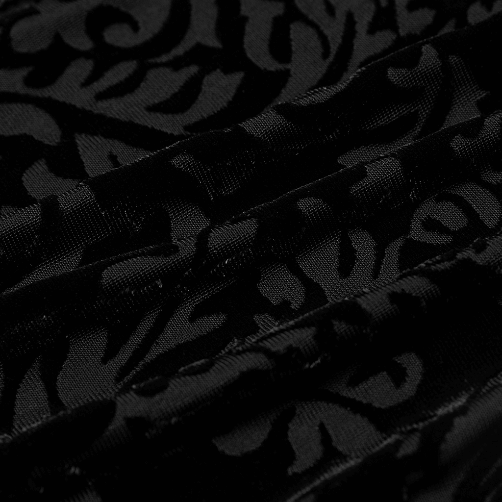 Close-up of luxurious black jacquard fabric with intricate floral design, perfect for gothic style clothing.
