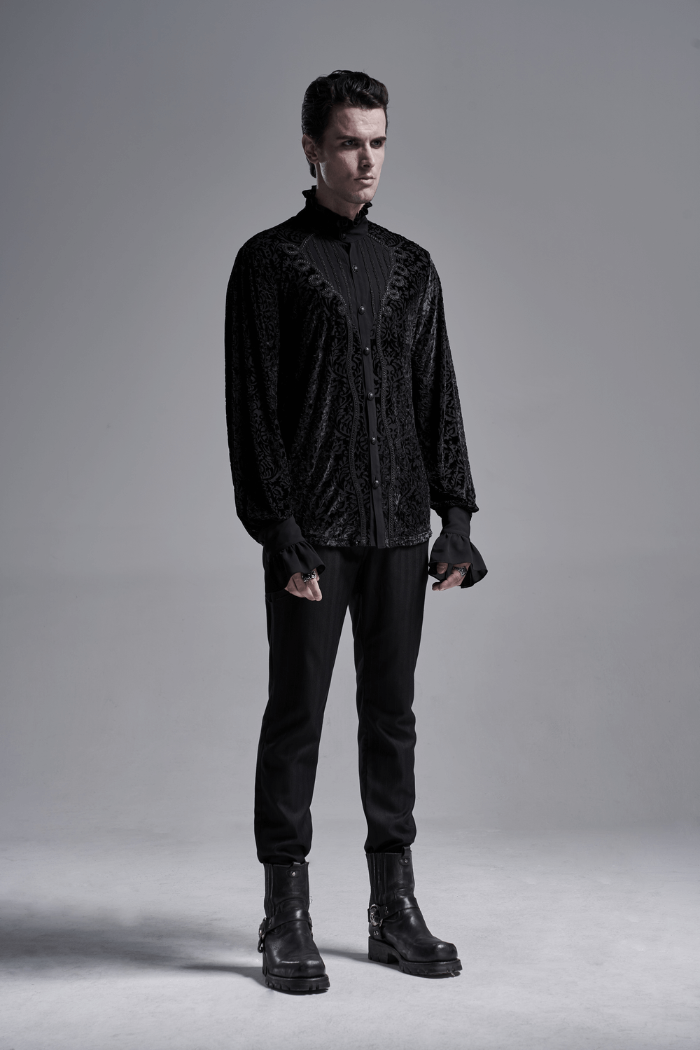 Men's gothic lace-up shirt in luxurious black velvet with intricate designs, styled for a dramatic Victorian-inspired look.