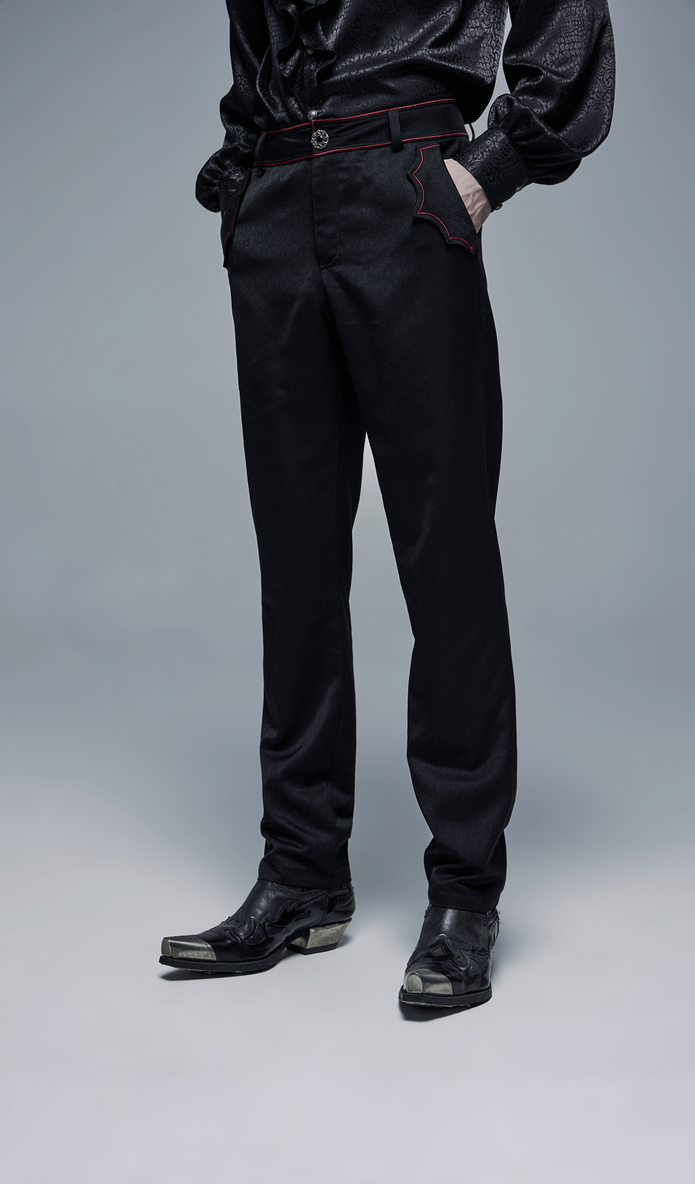 Men's dark aesthetic trousers with embroidered bat accents and red stitching, paired with stylish black shoes.