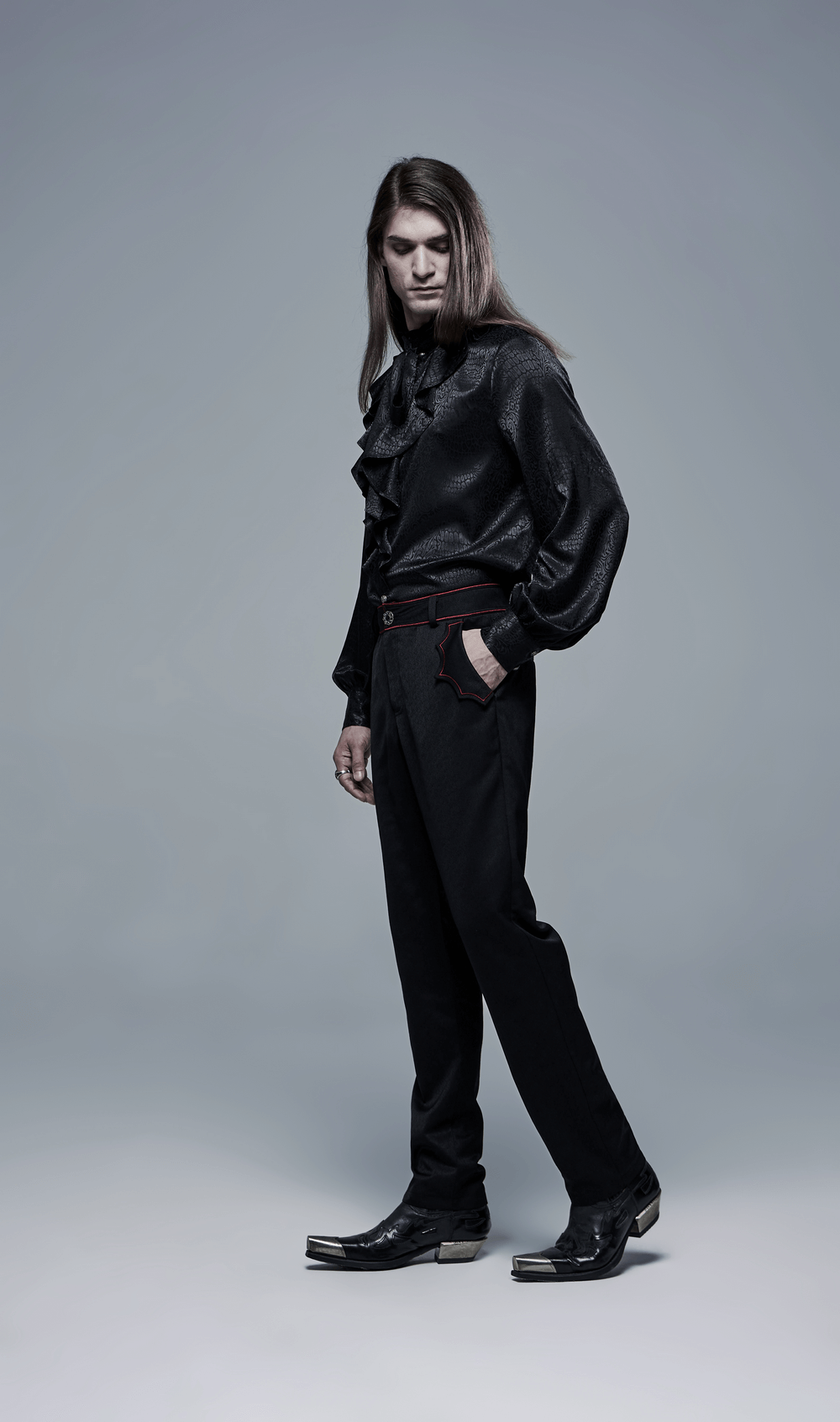 Men's tailored gothic trousers with bat embroidery, styled with a ruffled black shirt for a dark aesthetic.