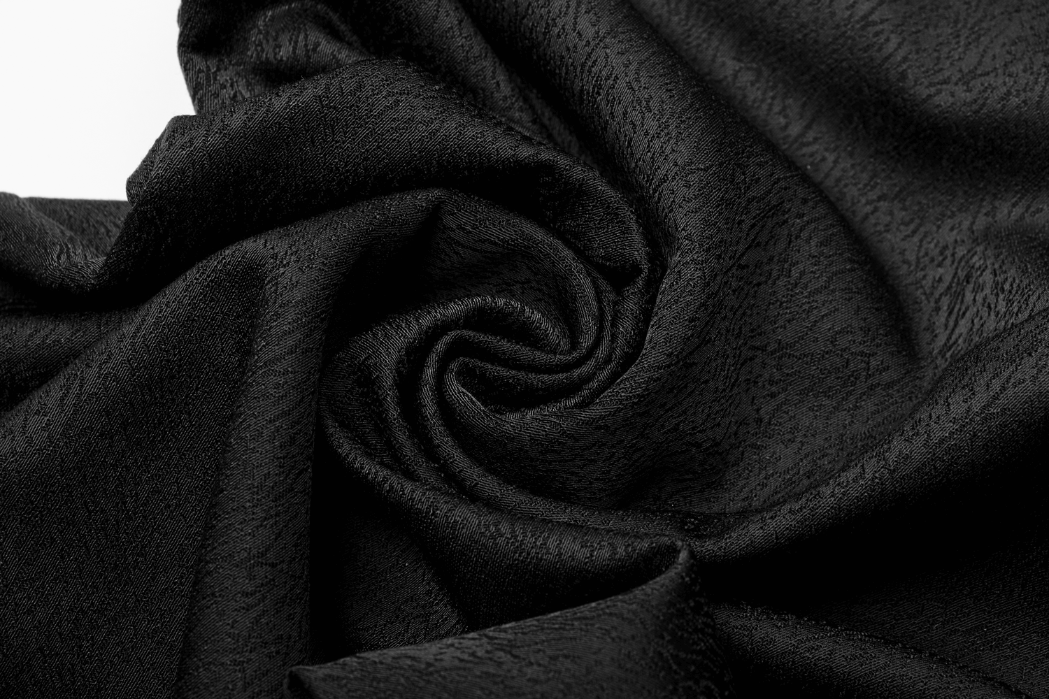 Close-up of textured black fabric, perfect for creating sophisticated dark aesthetic clothing.