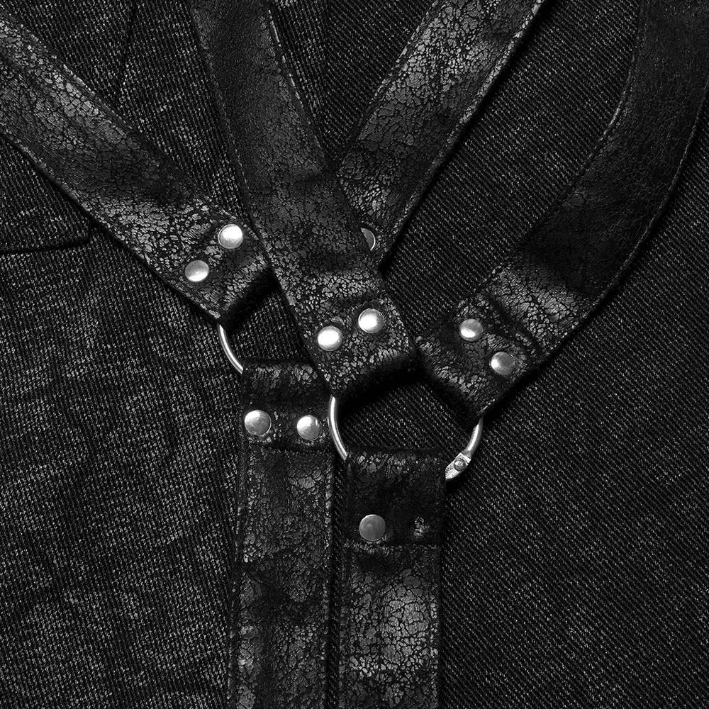 Close-up of black textured straps with silver hardware, perfect for a gothic kilt ensemble.