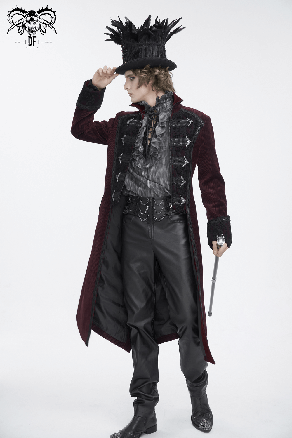 Gothic Victorian tailcoat in wine red with chains, high-collar, worn by a model in a top hat, perfect for steampunk events.