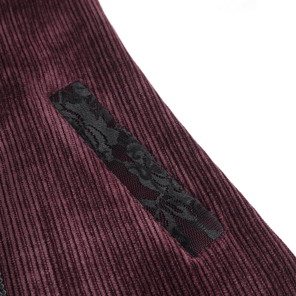 Close-up of the intricate black floral detailing on the wine red Gothic Victorian Tailcoat fabric.