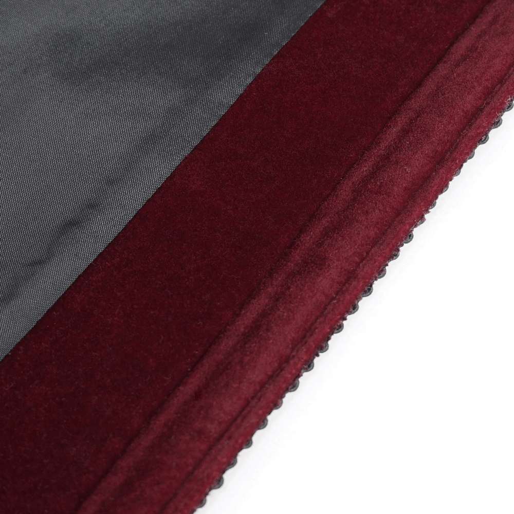 Close-up of the rich wine red trim on a Gothic Victorian tailcoat, showcasing detailed fabric texture.
