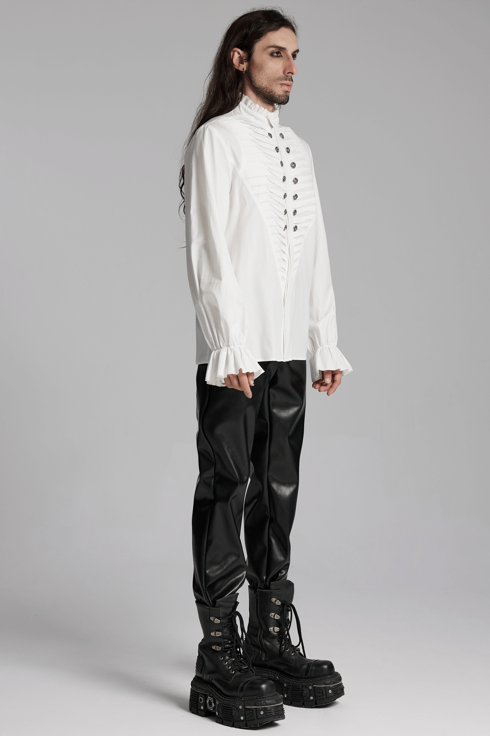 Men's Victorian white shirt with ruffle collar and metal buttons, paired with stylish black pants and boots.