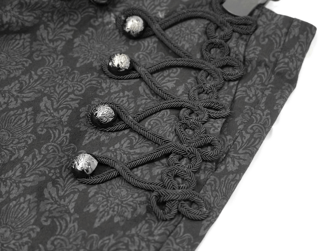 Close-up of black vintage pants featuring gothic decorative buttons and intricate rope designs.
