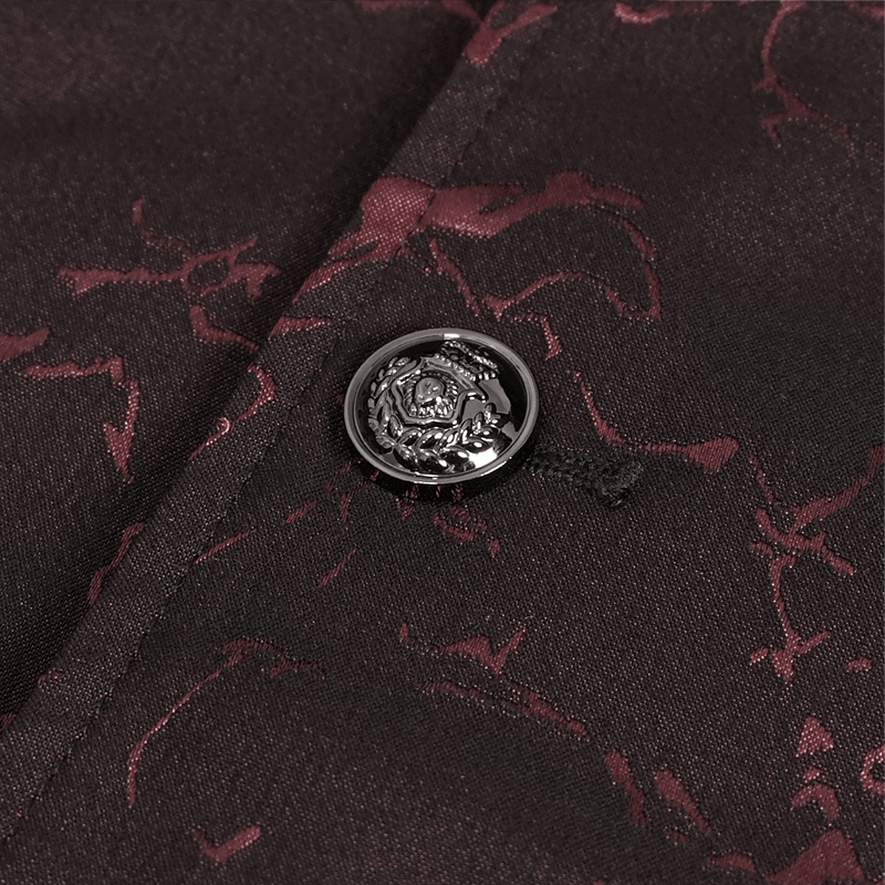 Close-up of a stylish black and wine red patterned fabric with an ornate button on a gothic men's coat.