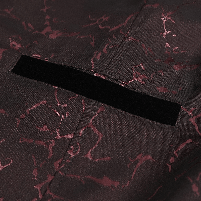Close-up of the elegant pocket detail on a men's wine red gothic coat with bright patterns.