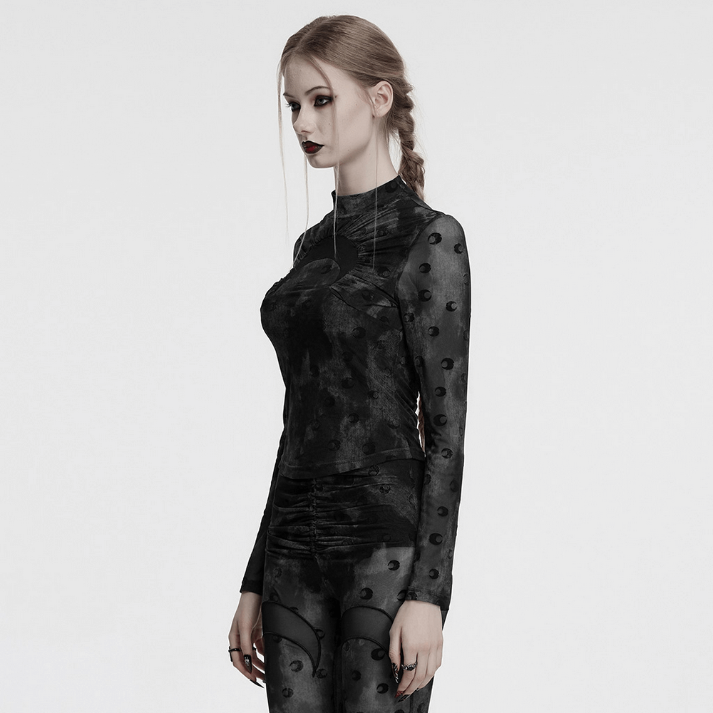 Model wearing a gothic mesh crescent print long sleeve top with high collar and fitted design, highlighting a unique cut-out pattern.