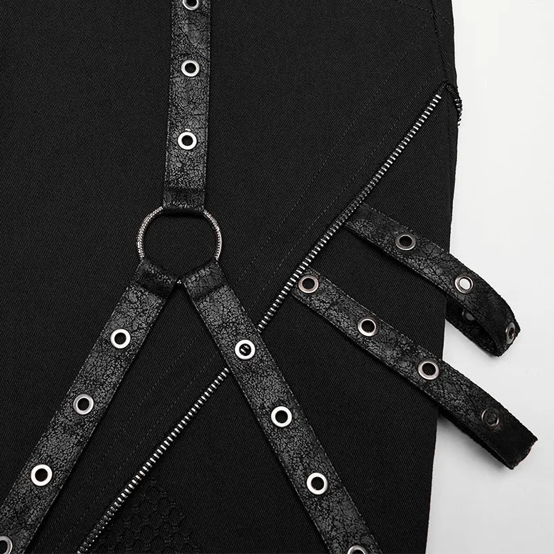 Close-up of mesh-paneled gothic pants with riveted details and detachable straps for edgy punk style.