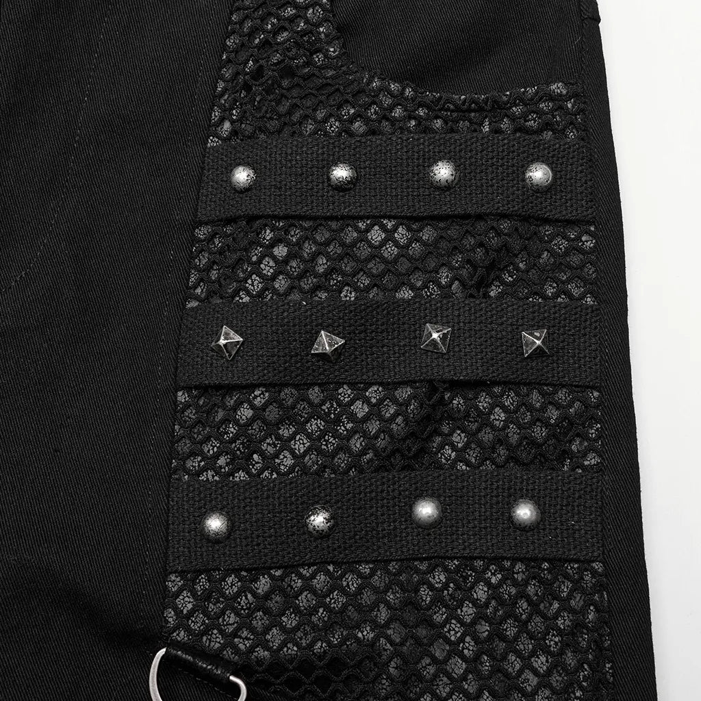 Close-up of black mesh-paneled pants with rivets and metal accents in Gothic style, perfect for punk fashion enthusiasts.