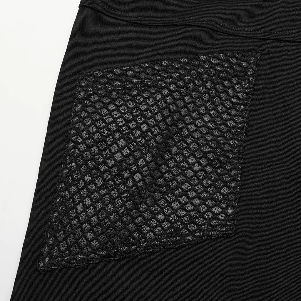 Close-up of a black mesh paneled accent on Gothic style wide-leg pants, showcasing edgy, punk-inspired detailing.