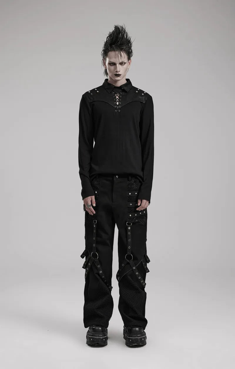 Model wearing Gothic-style wide leg punk trousers with riveted mesh details and detachable accents in a dramatic black ensemble.