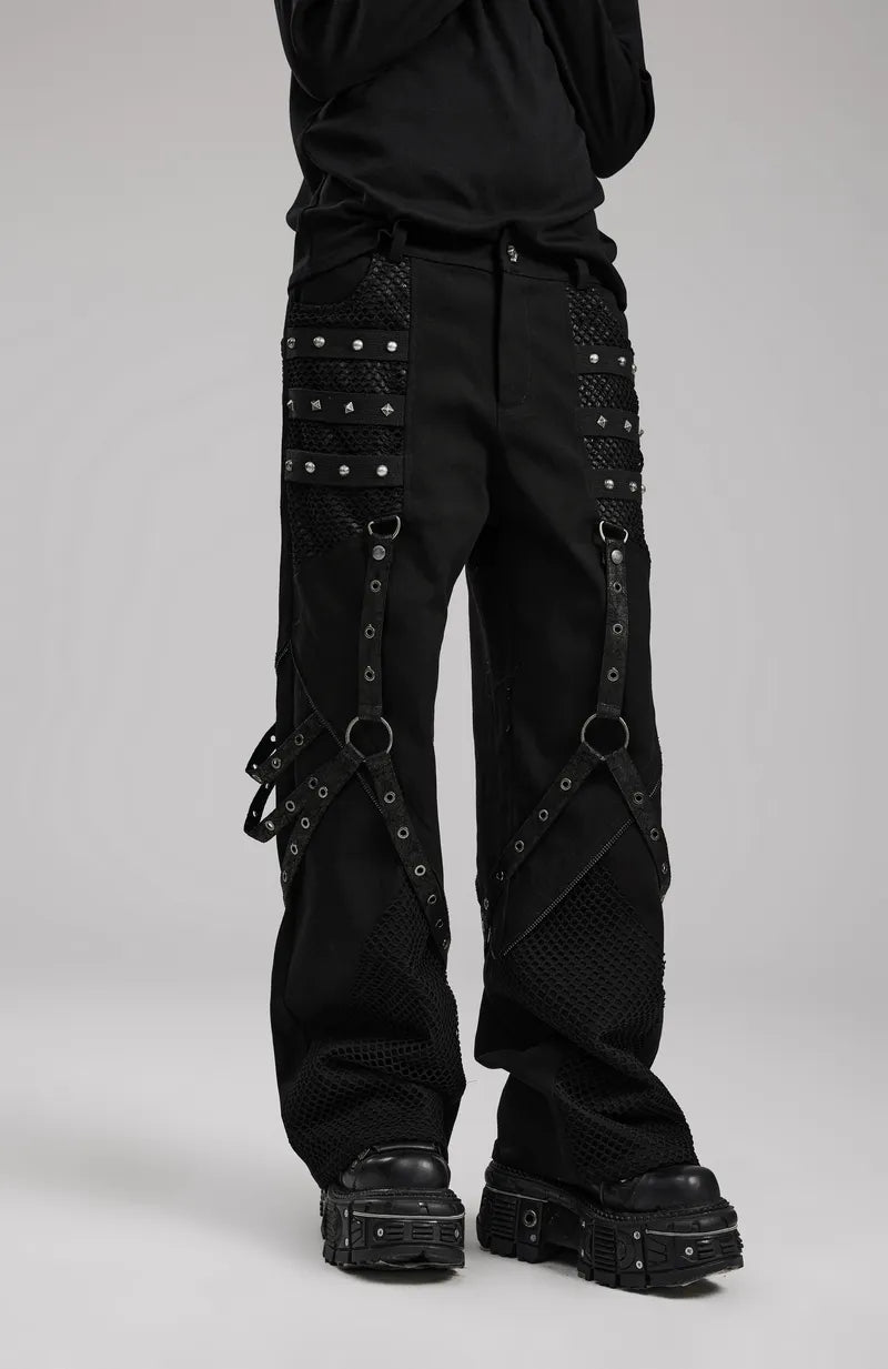 Punk wide-leg trousers with riveted mesh detailing in gothic style, featuring detachable accents and bold metal rivets.