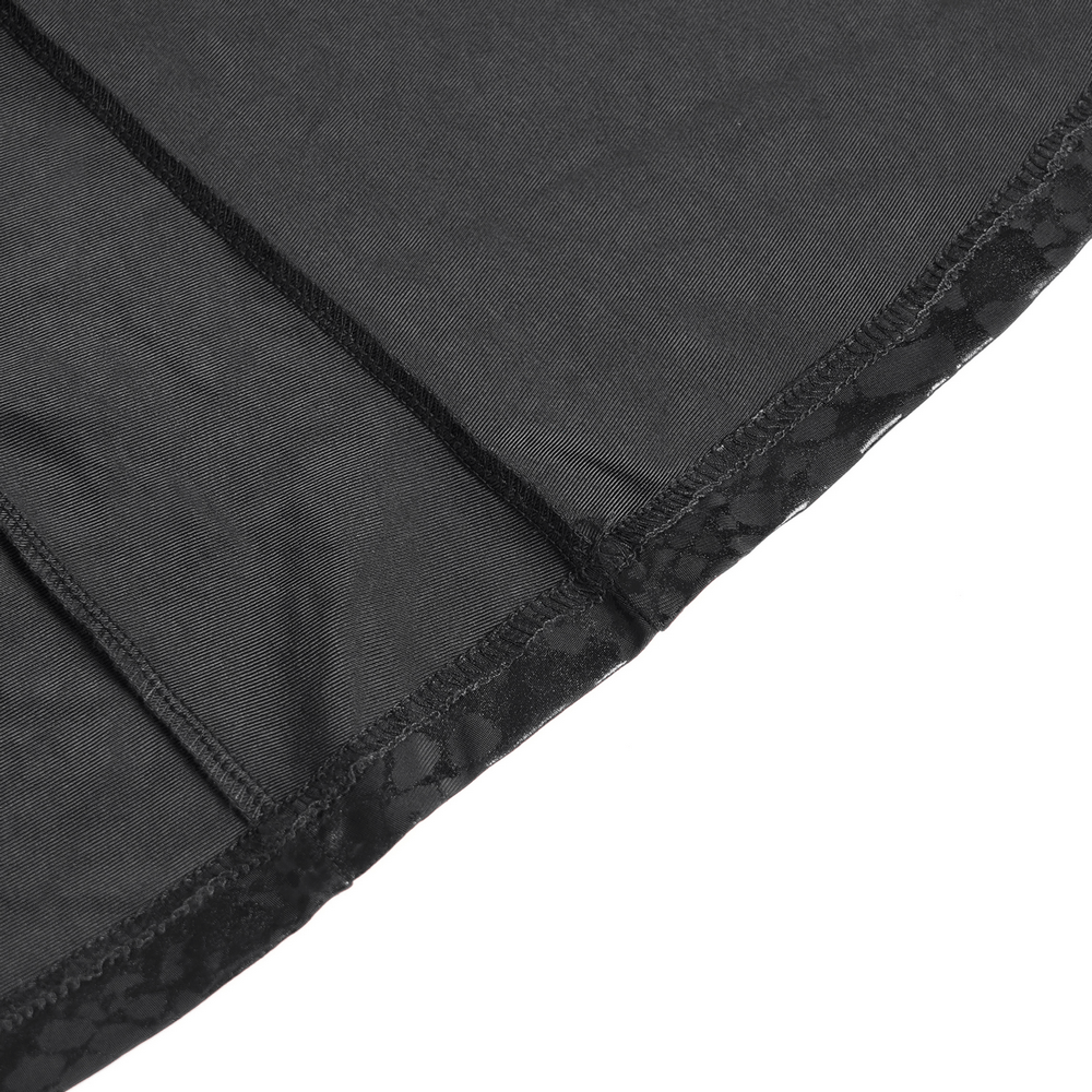 Close-up of the hem detailing on a gothic asymmetrical dress with sheer lace accents.