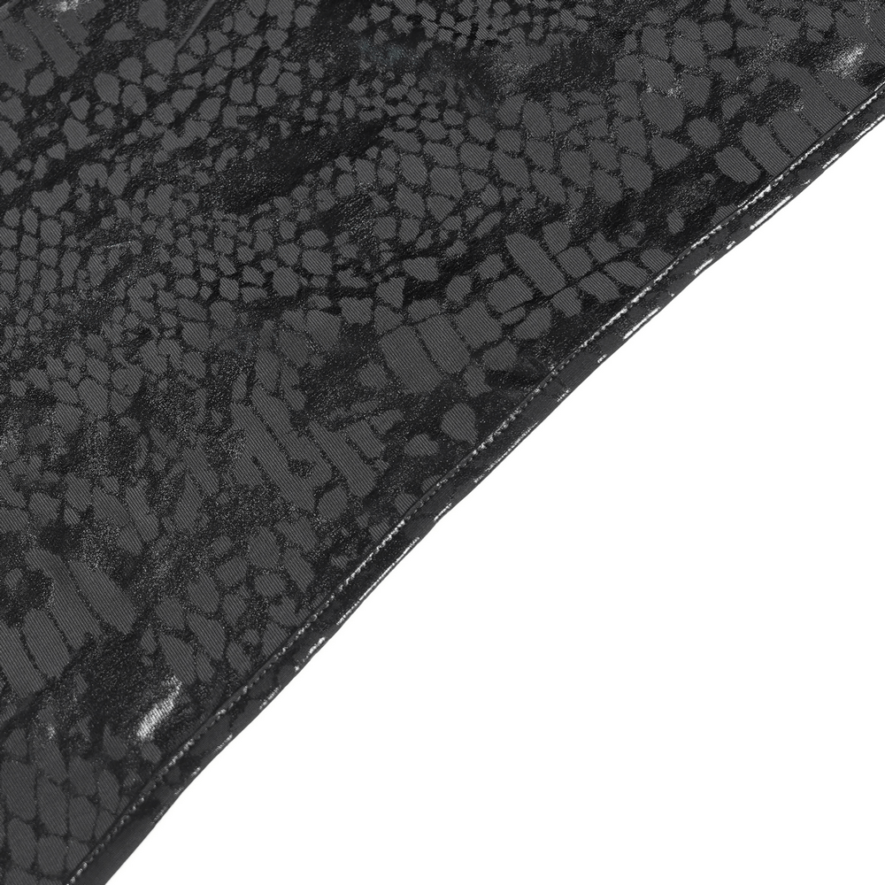 Close-up of snake-textured fabric showcasing dark patterns, perfect for edgy fashion designs.