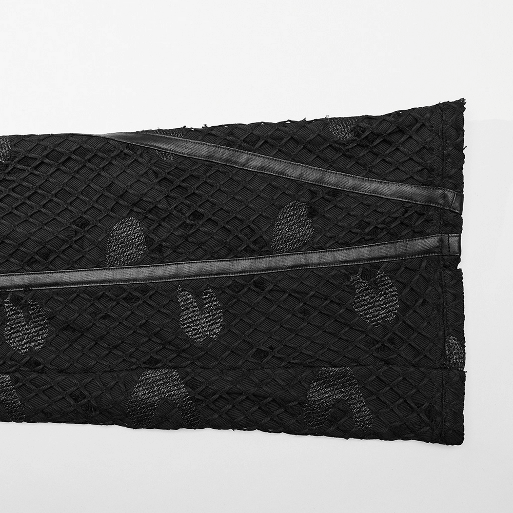 Detail of black mesh twill fabric with rubberized leather accents, perfect for edgy straight-leg pants.