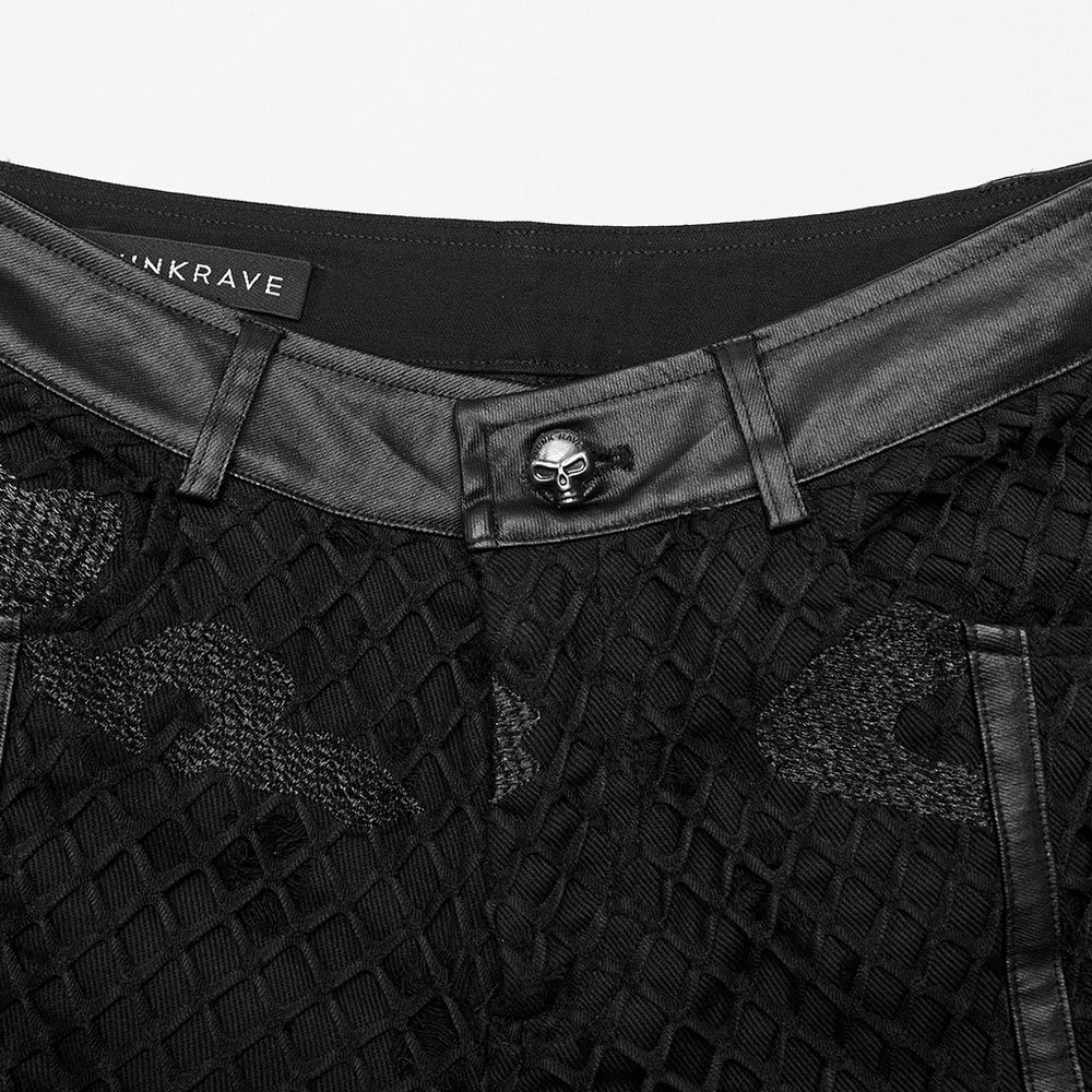 Close-up of the waistband and button of edgy mesh twill denim straight pants with leather accents.
