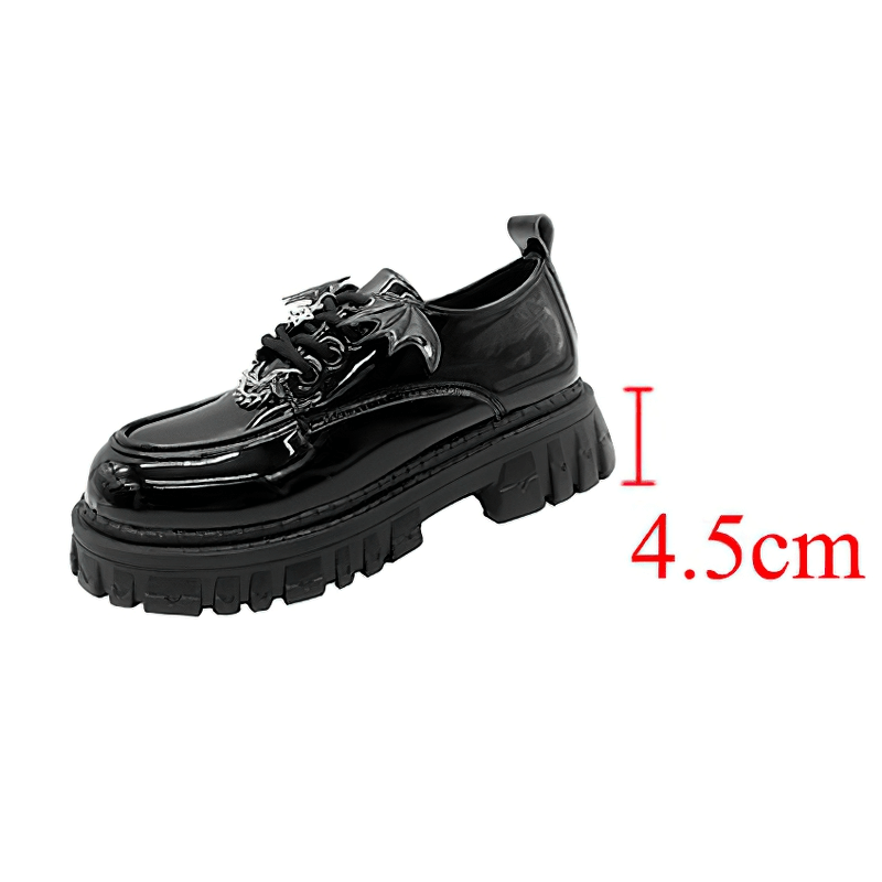 Black patent leather platform shoes with bat wing details and a chunky 4.5cm sole, perfect for gothic looks.