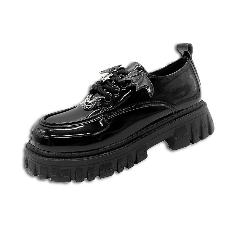 Metal chain bat wings chunky platform shoes in glossy black patent leather, perfect for a gothic night out.