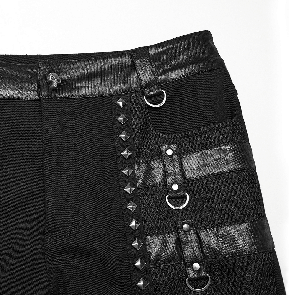 Close-up of metal punk stretch pants featuring studded straps and mesh details, showcasing an edgy design.