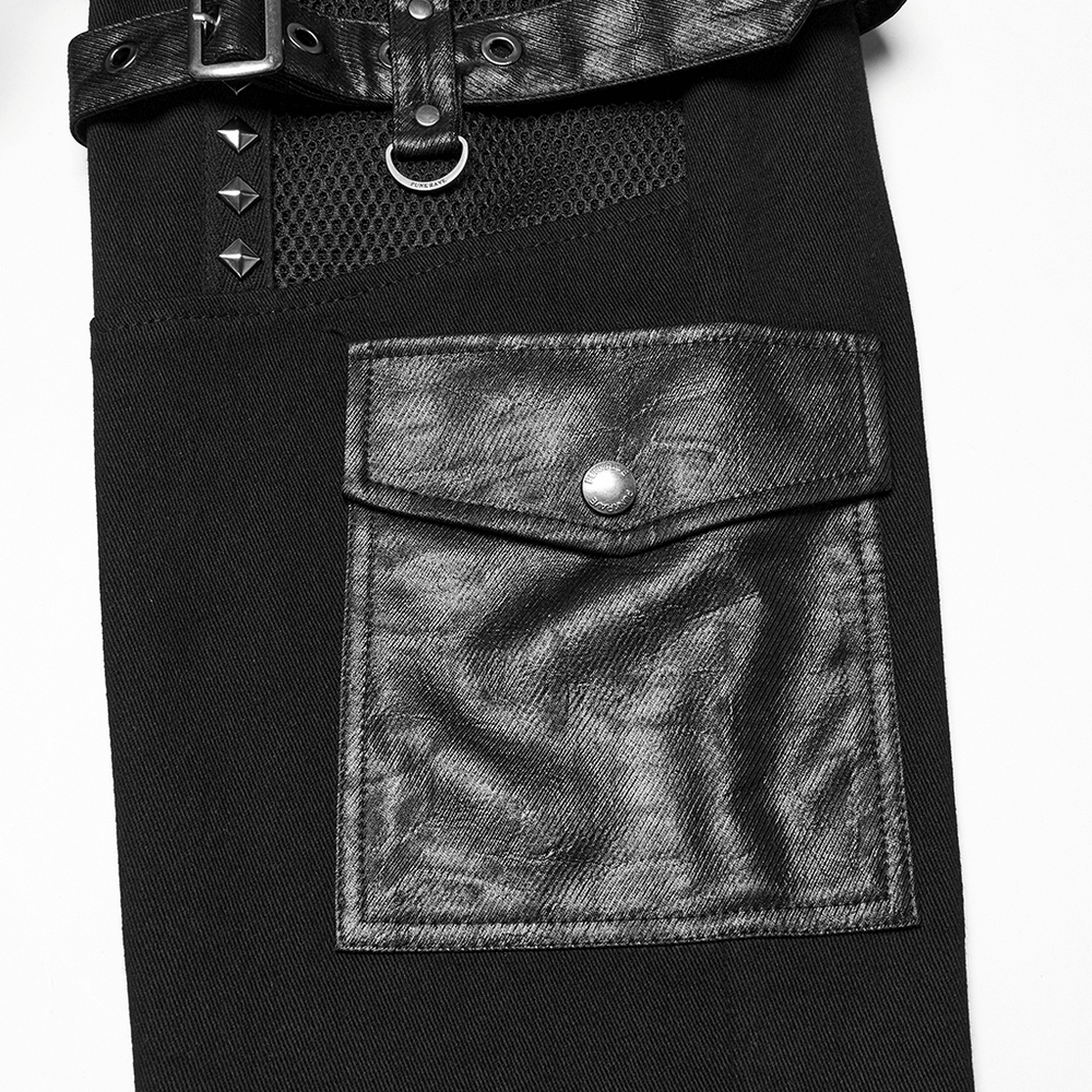 Close-up of metal punk stretch pants featuring studded straps, mesh detail, and a textured leather pocket.