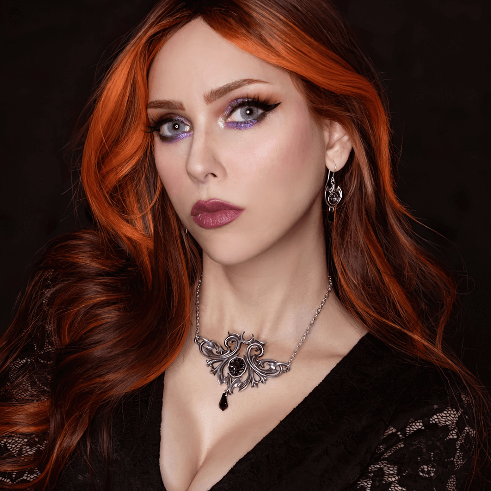 Elegant woman wearing Midnight Memorial Baroque Pendant and earrings with black crystal drop, showcasing dark elegance.
