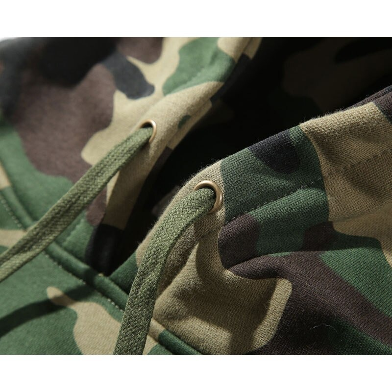 Close-up of army green camouflage hoodie showing drawstrings and fabric texture.